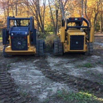 Two tractors parked side by side