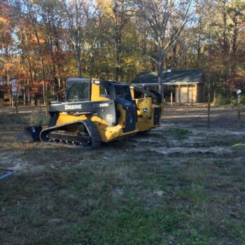 Tractor parked waiting to work on equestrian arena
