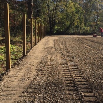 Tread marks from tractor on equestrian arena surface