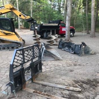 Trucks and equipment preparing to build an equestrian arena